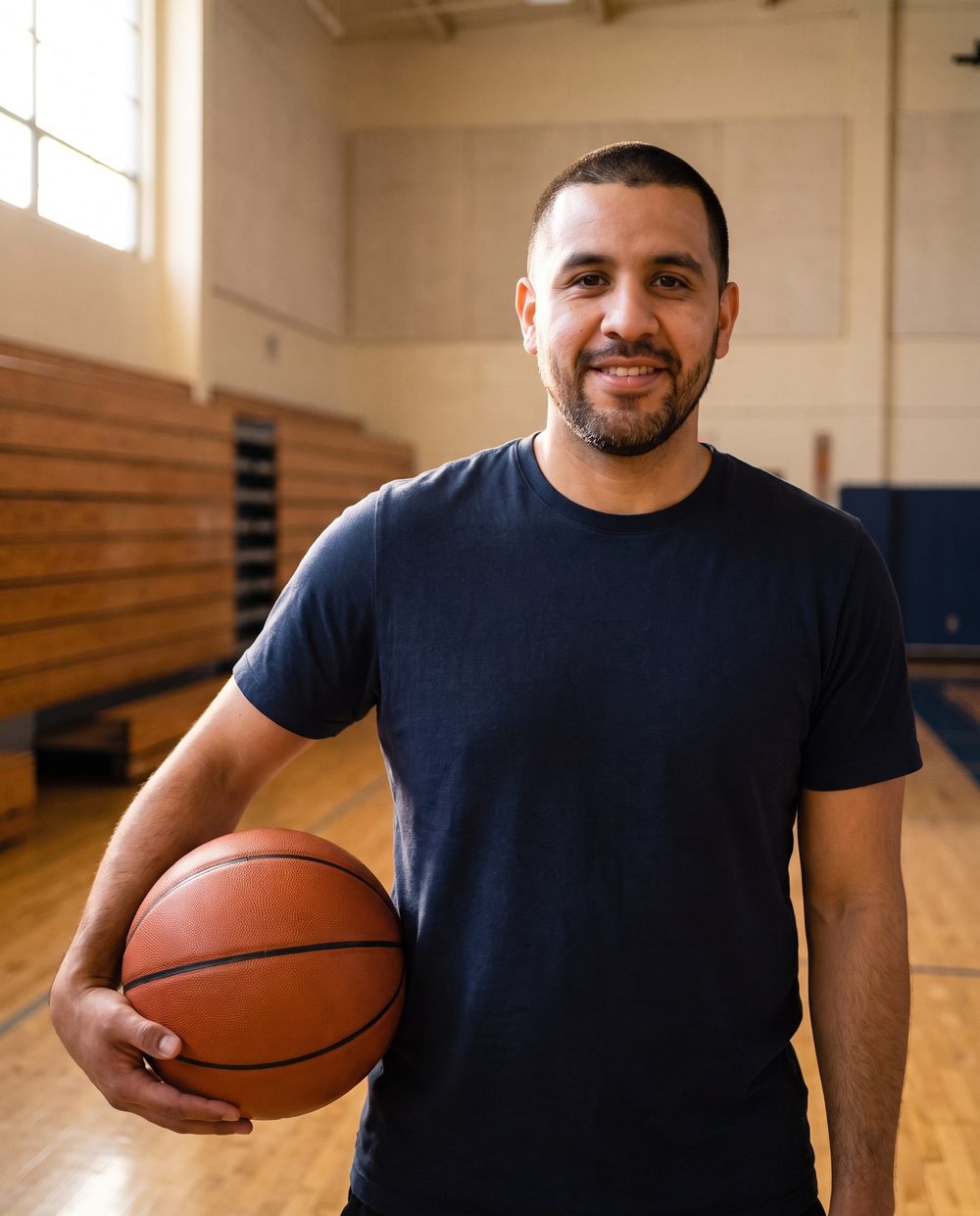 Marcus Vega courtside, holding a basketball